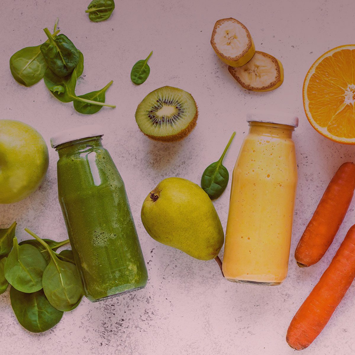 Juice bottles, fruit and vegetables from above