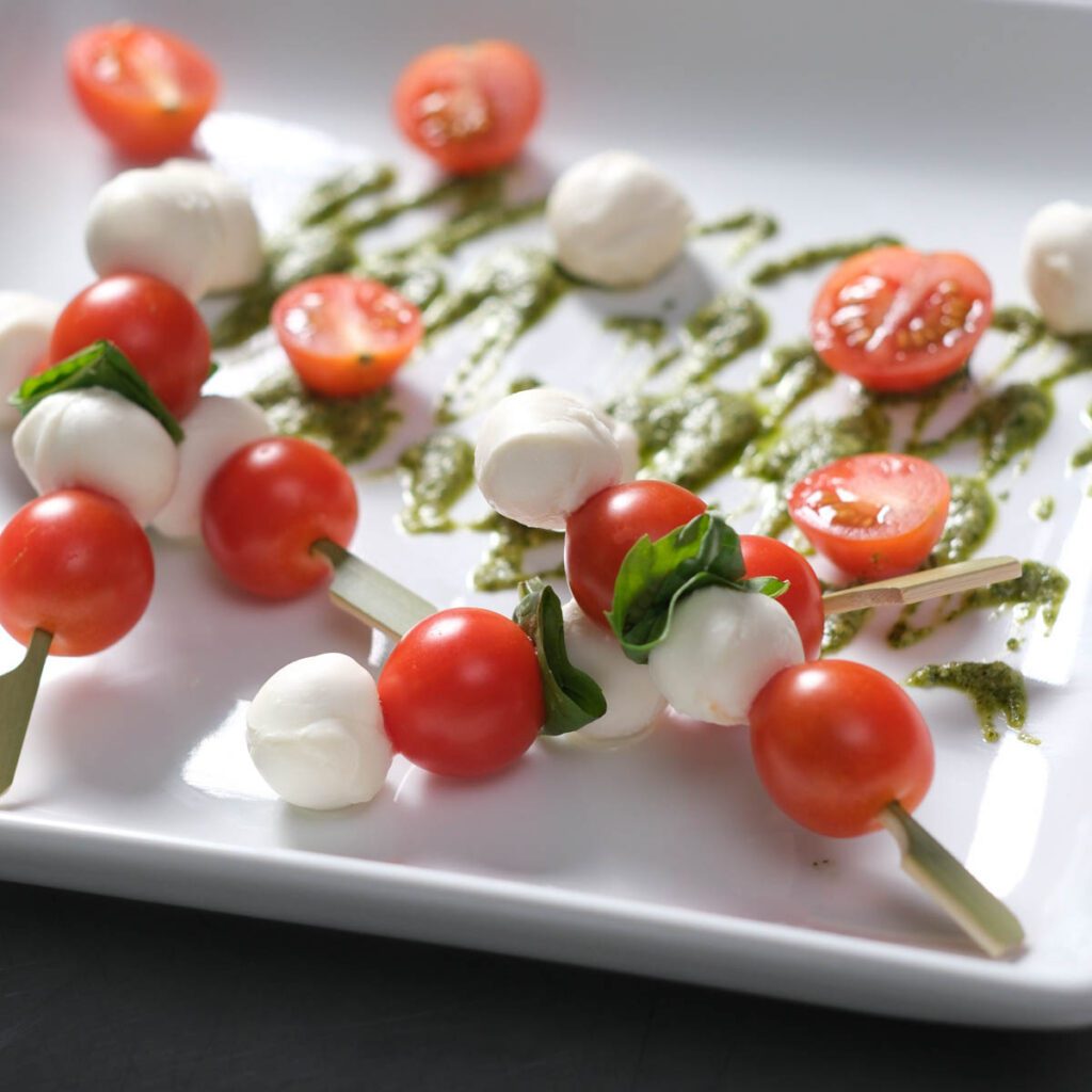 Caprese skewers with pesto glaze