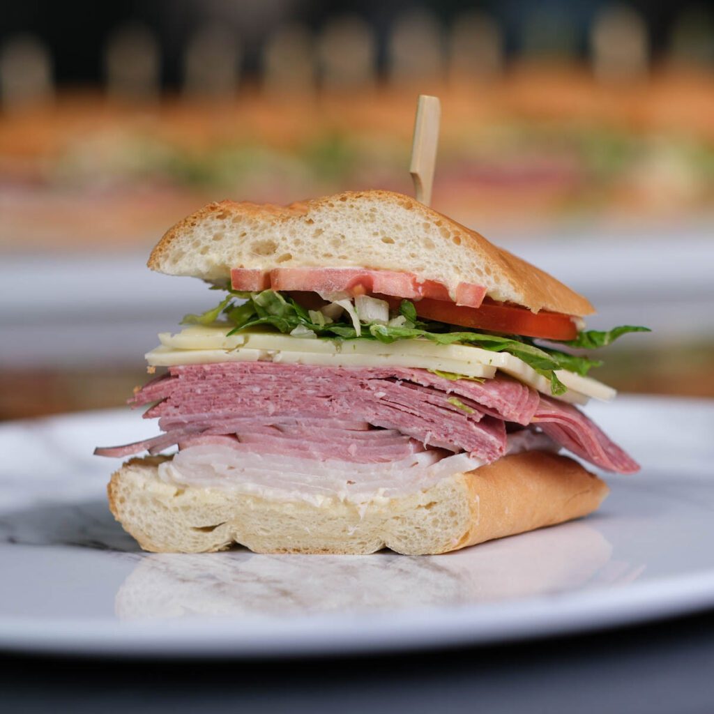 salami and turkey sandwich sliced in half